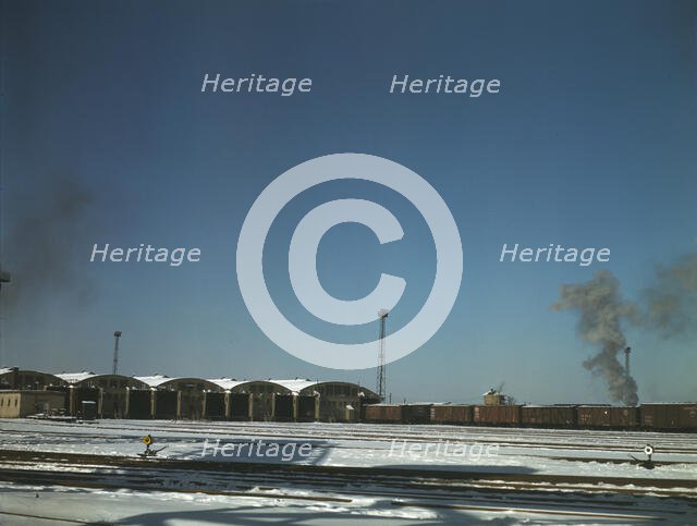 Train pulling out of the freight house at C & NW RR's Proviso Yard, Chicago, Ill., 1942. Creator: Jack Delano.