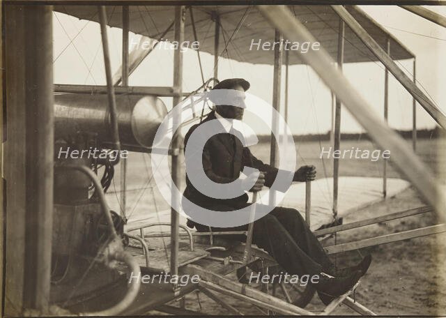 Wilbur Wright in the flyer, 1908. Creator: Anonymous.