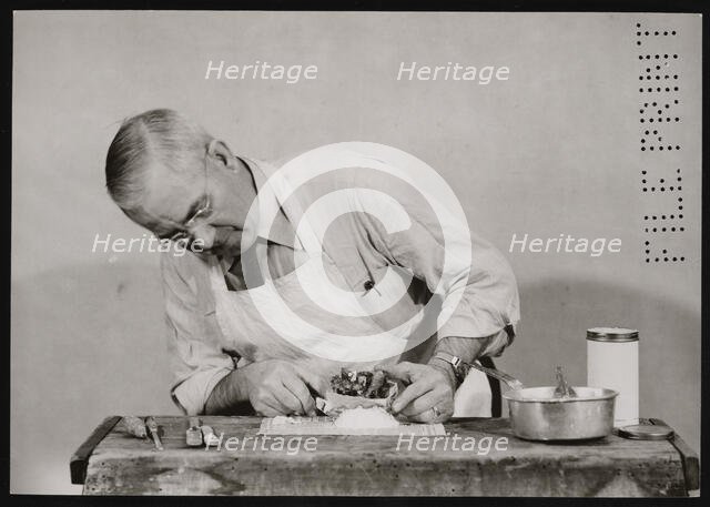 Frank Earl Holden Demonstrates Cutting into Mineral, January 18, 1951. Creator: United States National Museum Photographic Laboratory.