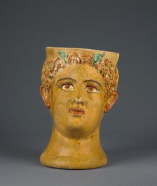 Lead-Glazed Head Kantharos, 1st century B.C. Creator: Likinnios.