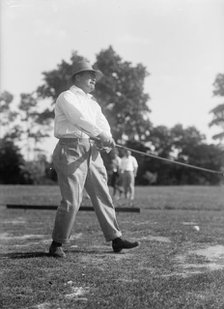 Reynolds, Ziba W. Pay Inspector of The Navy - Playing Golf, 1916. Creator: Harris & Ewing.