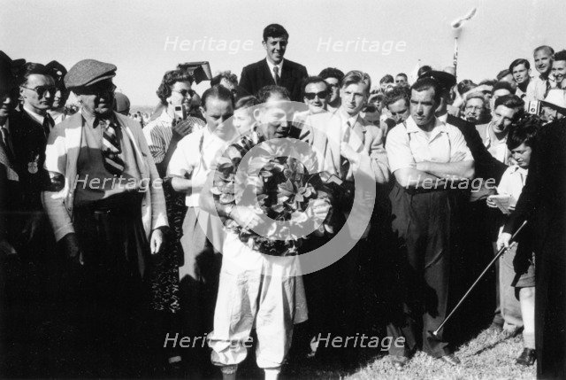 Stirling Moss, winner of the British Grand Prix, Aintree, 1955. Artist: Unknown