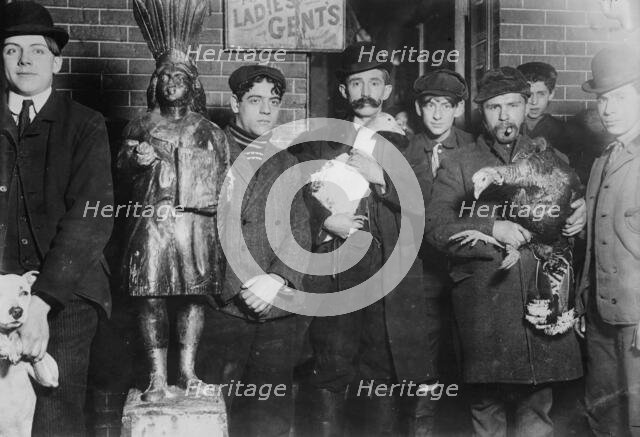 Taking home geese won at raffle, Xmas, 1910. Creator: Bain News Service.