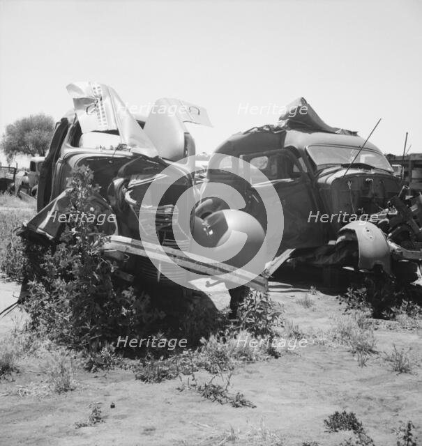 Used car lots and auto wrecking establishments, U.S. 99,  Near Tulare, California, 1939. Creator: Dorothea Lange.