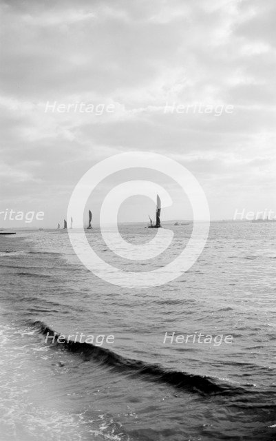 A line of Thames sailing barges, Gravesend Reach, Kent, c1945-c1965. Artist: SW Rawlings