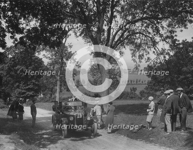 Austin 12/4 open 4-seater tourer competing in the JCC Inter-Centre Rally, 1932. Artist: Bill Brunell.