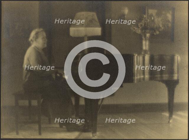Portrait of a Woman Seated at the Piano, 1895-1907. Creator: Louis Fleckenstein.
