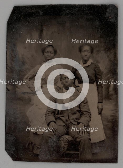 Untitled (Portrait of Two Standing Women and One Seated Man), 1880. Creator: Unknown.