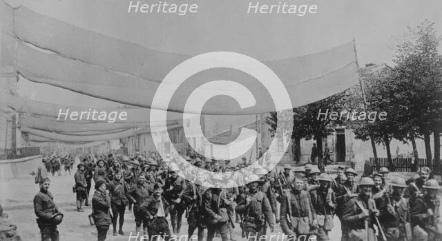 U.S. troops on camouflaged road, 11 May 1918. Creator: Bain News Service.