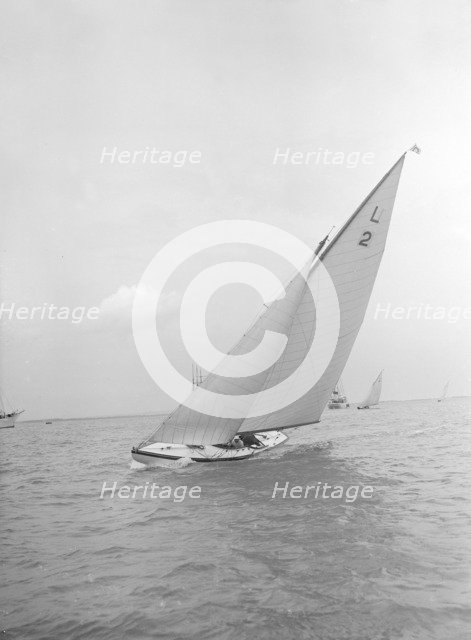 The 6 Metre Cynthia sailing upwind, 1912. Creator: Kirk & Sons of Cowes.