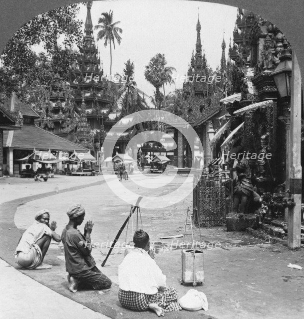 Worshipping before an idol, Shwedagon Pagoda, Rangoon, Burma, 1908. Artist: Stereo Travel Co
