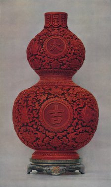 'Vase of Carved Red Lacquer on Olive Green Ground with Stand of Flat Lacquer', 1928. Artist: Unknown.