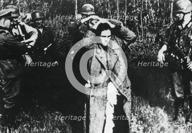 German soldiers with Russian prisoners, Russia, 1941. Artist: Unknown