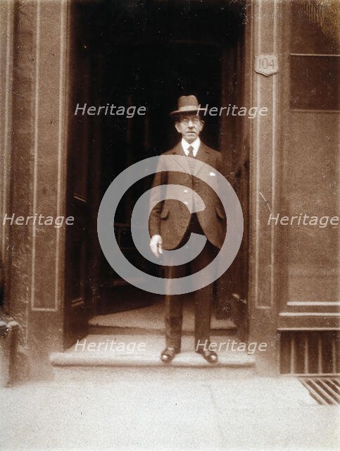 An unidentified man standing in a doorway, 1926. Creator: William Brown.