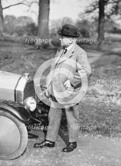 Victor Holroyd with a Triumph car. Artist: Unknown