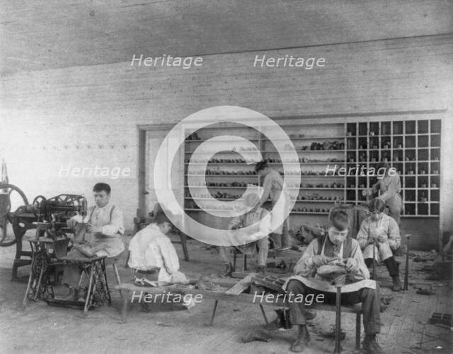 Classroom scenes at Carlisle, Pa., Indian School. Shoe making and repairing; male students, 1901. Creator: Frances Benjamin Johnston.
