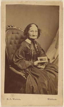 Elderly woman holding a photograph, about 1865. Creator: Henry F Warren.