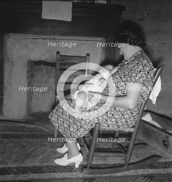 Tobacco sharecropper's wife nurses the baby after washing..., Person County, North Carolina, 1939. Creator: Dorothea Lange.