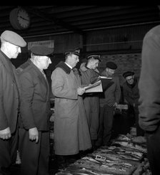 Wholesalers and fishmongers at the fish auction, Gothenburg, Sweden, 1960. Artist: Torkel Lindeberg