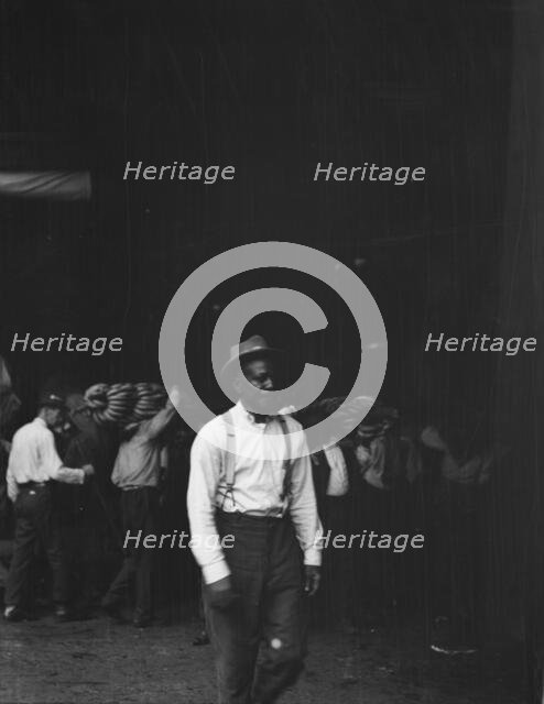 Unloading bananas, New Orleans, between 1920 and 1926. Creator: Arnold Genthe.