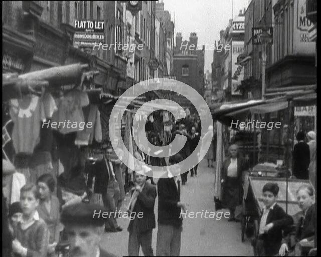 Crowds Milling Around Berwick Street Market, 1930s. Creator: British Pathe Ltd.