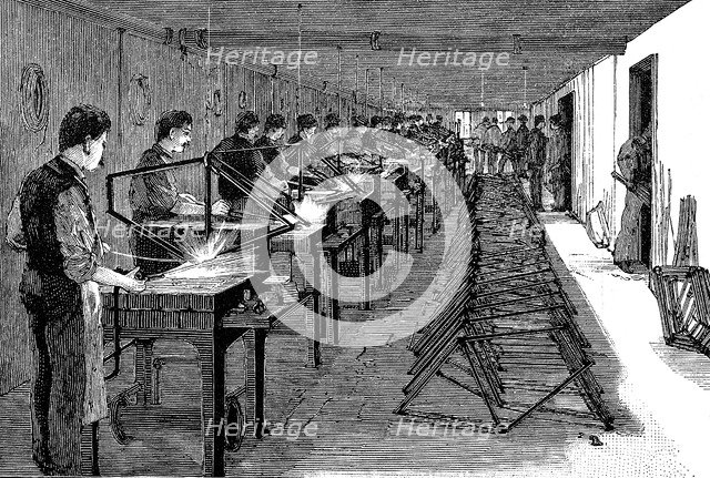 Welding bicycle frames in an American factory, 1900. Artist: Unknown