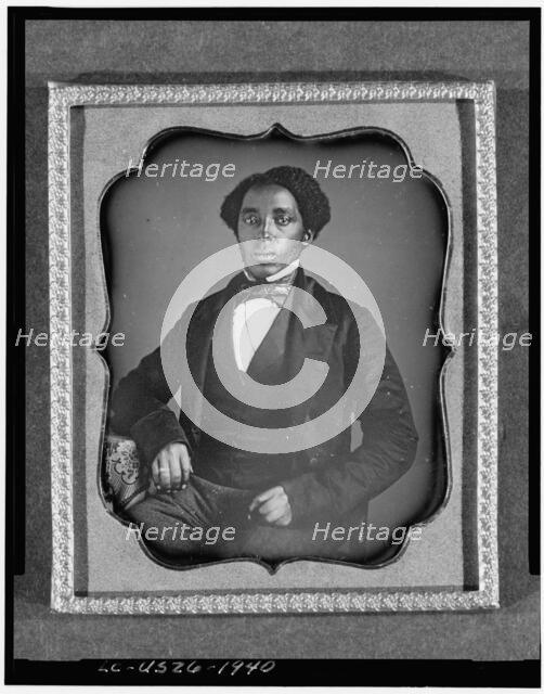 Unidentified man, three-quarter length portrait, full face, with arm on..., between 1849 and 1860. Creator: Unknown.