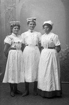 Portrait of three female dairy workers, Landskrona, Sweden, 1910. Artist: Unknown