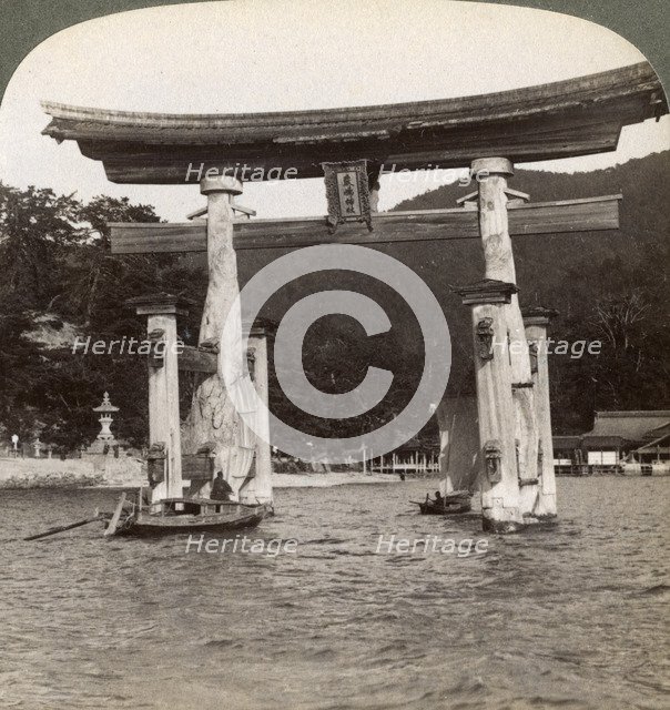 Sacred torii gate rising from the sea, Itsukushima Shrine, Miyajima Island, Japan, 1904. Artist: Underwood & Underwood