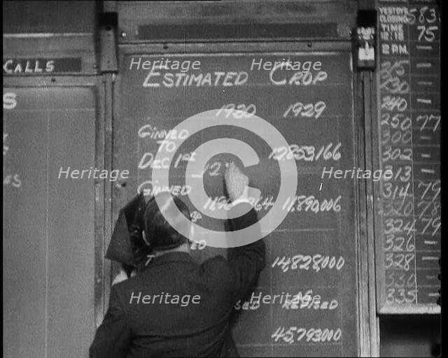 Male Civilian Writing the Newest Stock Prices On a Blackboard, 1932. Creator: British Pathe Ltd.