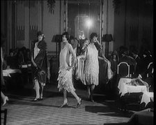 A Group of Female Civilians Modelling Various Glamorous Outfits in a Fashion Parade, 1920. Creator: British Pathe Ltd.