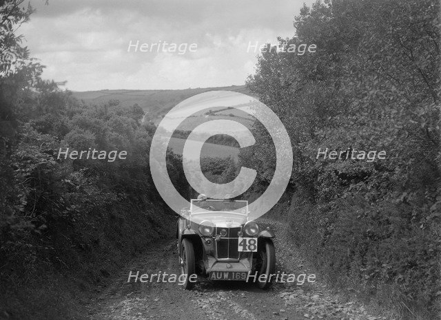MG Magna competing in the Mid Surrey AC Barnstaple Trial, 1934. Artist: Bill Brunell.