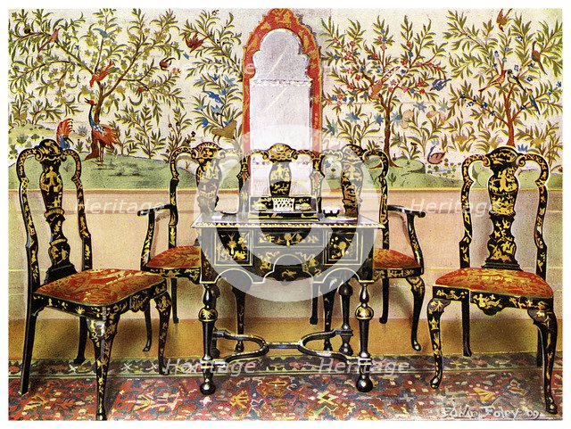 Black lacquer settee, chairs and table and red lacquer mirror, 1910.Artist: Edwin Foley