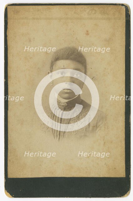 Photograph of a girl wearing a pleated dress, 1885-1900. Creator: Unknown.