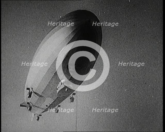 Airship Approaching an Aircraft Carrier And Attempting To Land, 1920s. Creator: British Pathe Ltd.