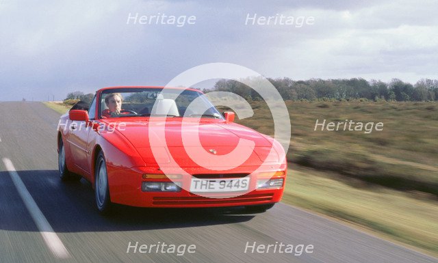 1990 Porsche 944 cabriolet driving along. Artist: Unknown.