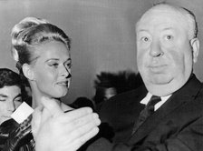 Film director Alfred Hitchcock with the star of 'The Birds', Tippi Hedren, Cannes, France, 1965. Artist: Unknown