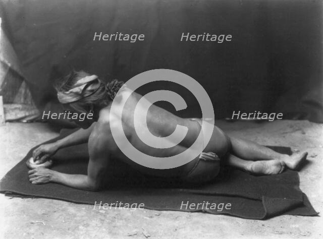 Grinding medicine-Zuni, c1903. Creator: Edward Sheriff Curtis.