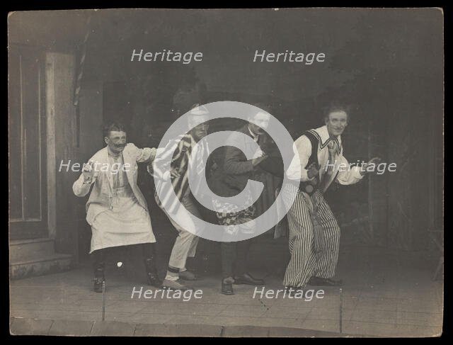 Sailors on stage in mid-pose, wearing a variety of costumes, [between 1910 and 1919?]. Creator: Unknown.