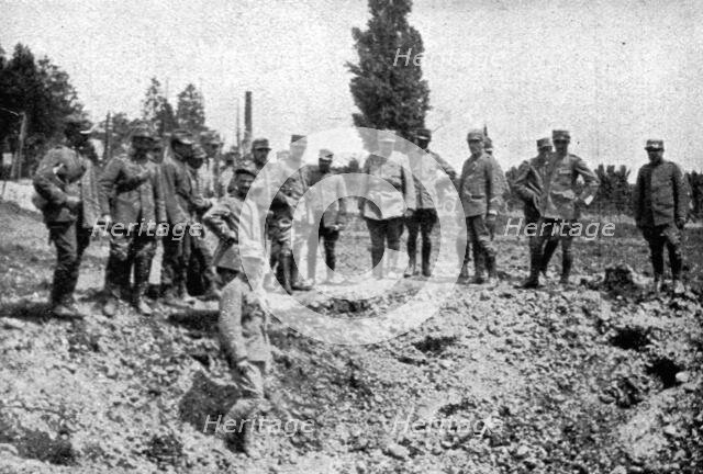 'les premieres operations Italiennes; le premier entonnoir creuse par un 305 autrichien', 1915. Creator: Unknown.