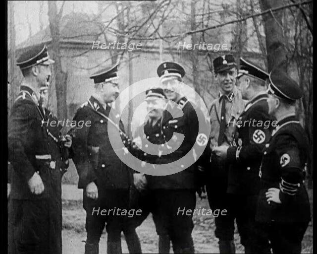 Uniformed Nazis Talking to Each Other, 1933. Creator: British Pathe Ltd.