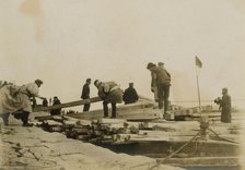 Japanese removing timbers from lighters at Chemulpo for erection of runways, c1904. Creator: Robert Lee Dunn.