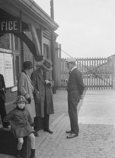 Group of people outside a Metropolitan Line railway station, London, 1930s.   Artist: Bill Brunell.