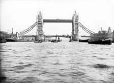 Tower Bridge with bascules closed and barges passing under at high water, London, c1905. Artist: Unknown