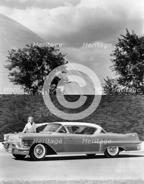 Woman with a 1957 Cadillac coupe de ville, (c1957?). Artist: Unknown