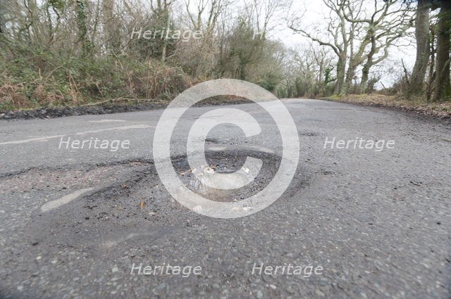 Pot holes in road surface 2017. Creator: Unknown.
