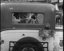 Bullet Holes Through the Back Window of a Car, 1932. Creator: British Pathe Ltd.