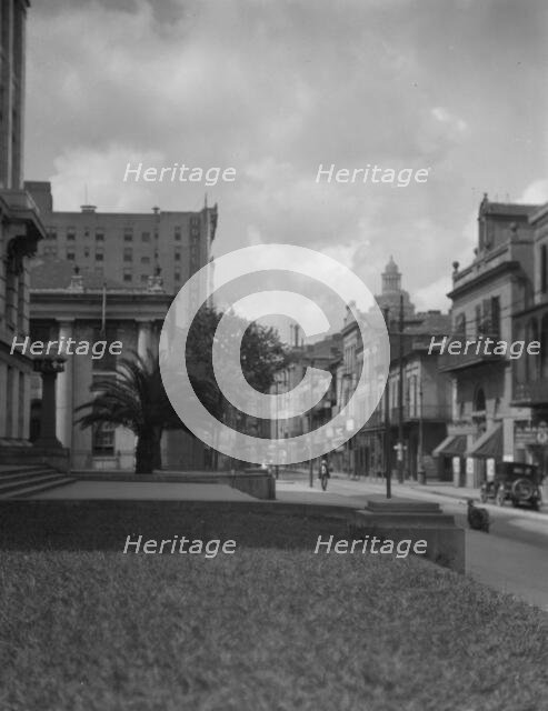 At the corner of Royal and Conti streets, New Orleans, between 1920 and 1926. Creator: Arnold Genthe.