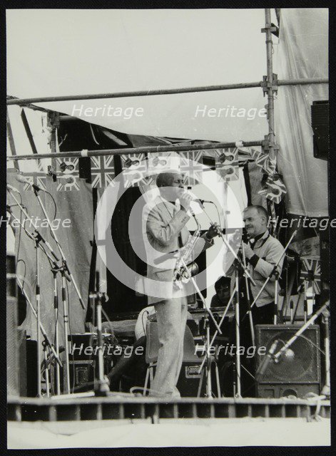 Denis Williams photographing Eddie 'Cleanhead' Vinson at Knebworth, Hertfordshire, 1981. Artist: Unknown