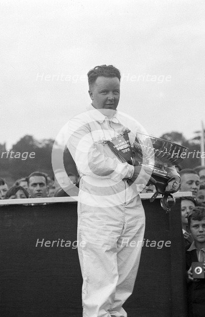 British racing driver Bert Hadley, winner of the Imperial Trophy race, Crystal Palace, 1939. Artist: Bill Brunell.